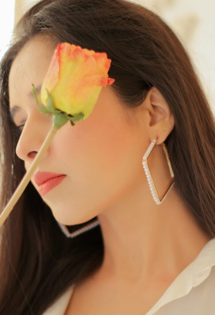 classic photography women model with flower wearing earring