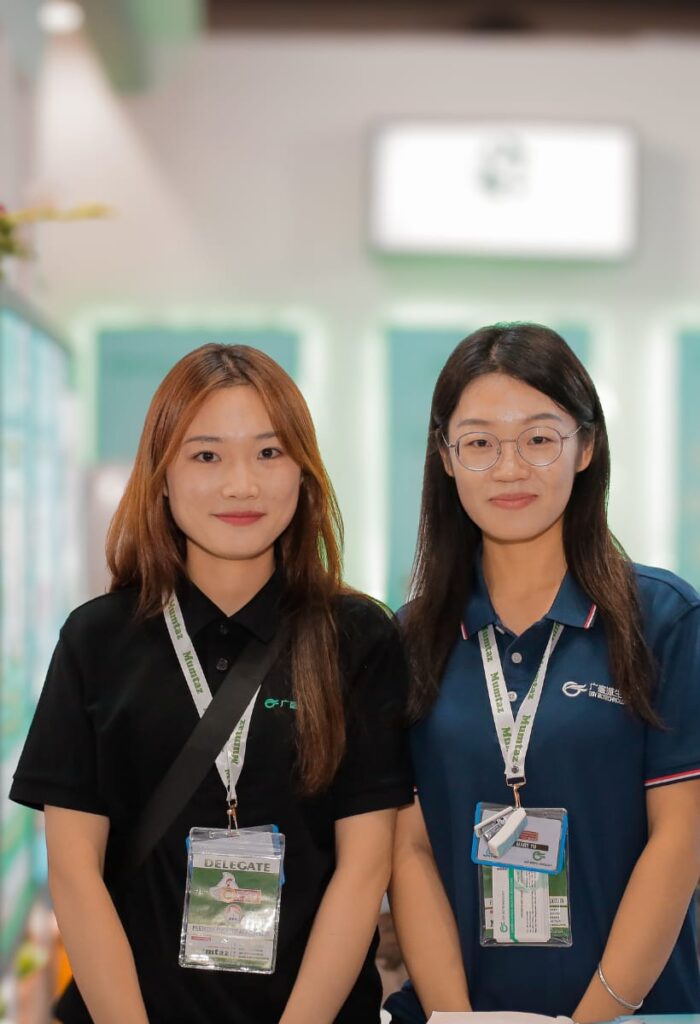 two women chinese corporate company standing in office